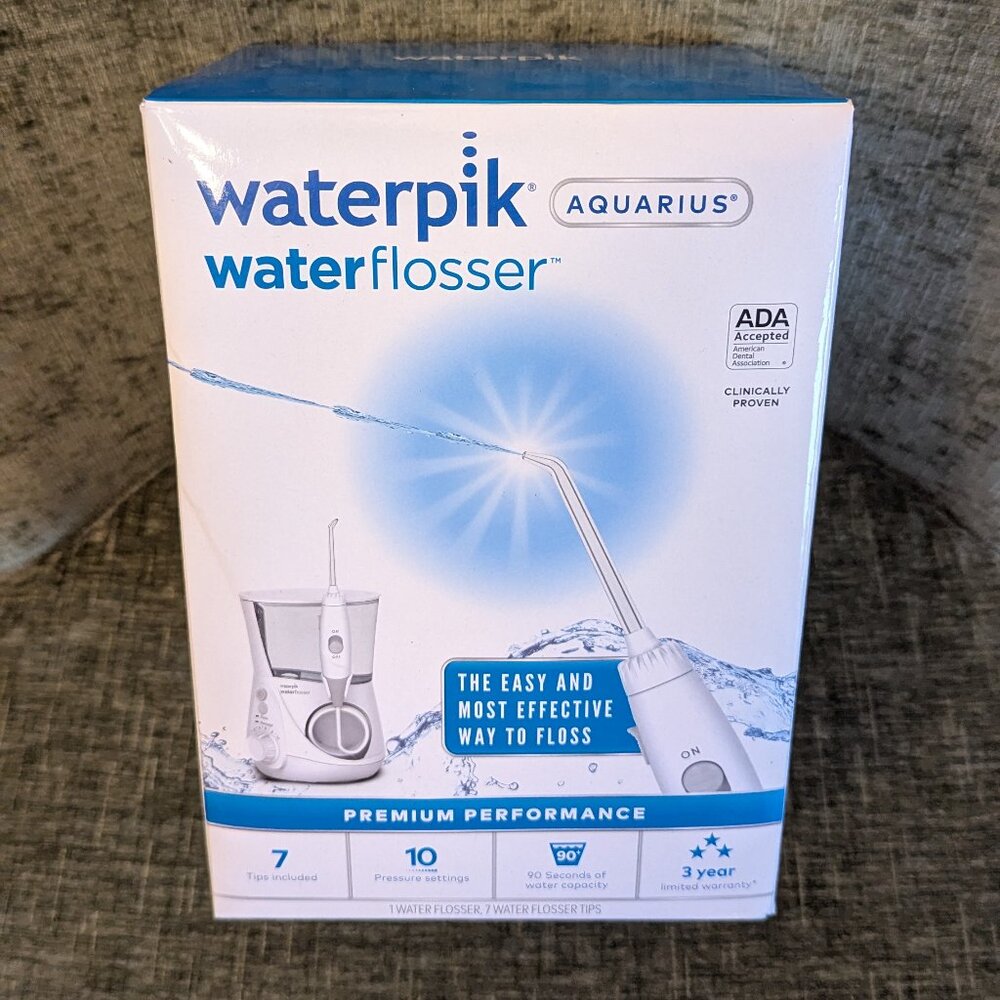 SEALED, Waterpik Aquarius Water Flosser. Electric Power With 10 Settings, 7 Tips